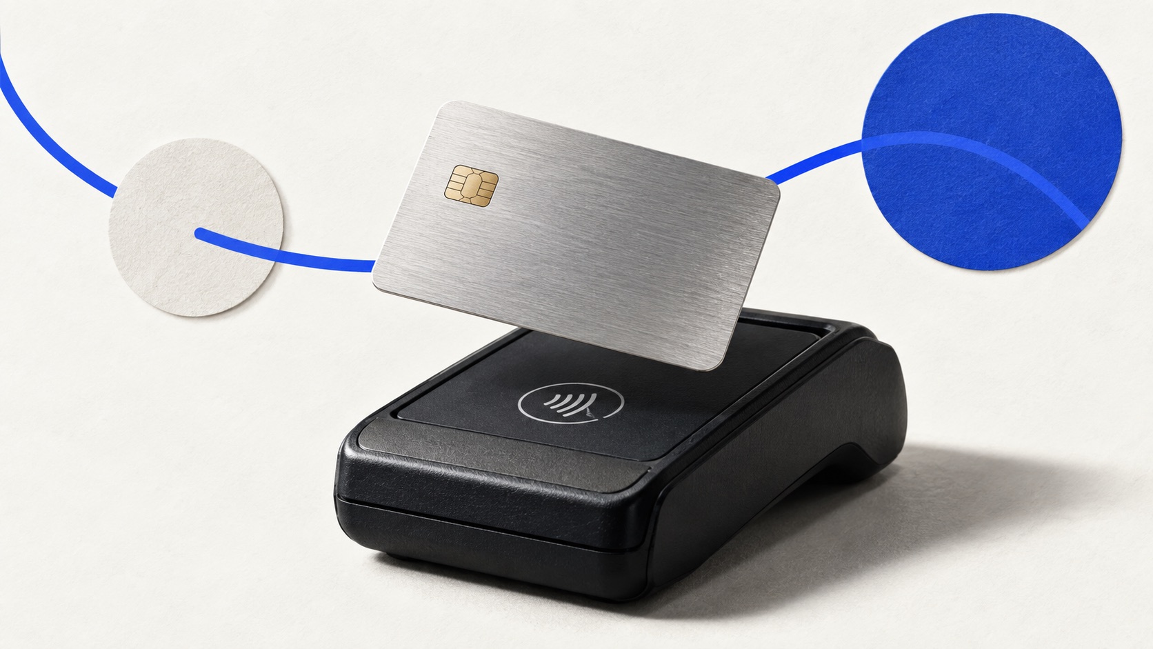 Payment terminal, card and receipt on a pale desk